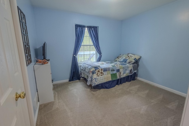 carpeted bedroom with baseboards
