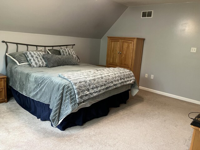 bedroom featuring carpet, vaulted ceiling, and baseboards
