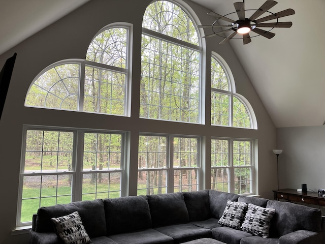 living room with high vaulted ceiling, ceiling fan, and plenty of natural light