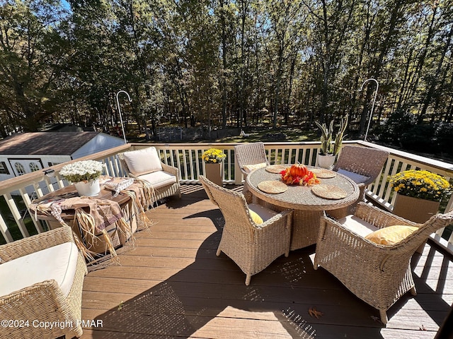 deck with outdoor dining space