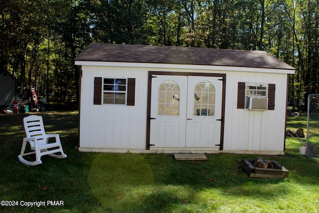 view of shed featuring an outdoor fire pit