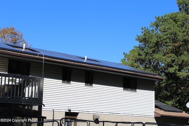 view of home's exterior with solar panels