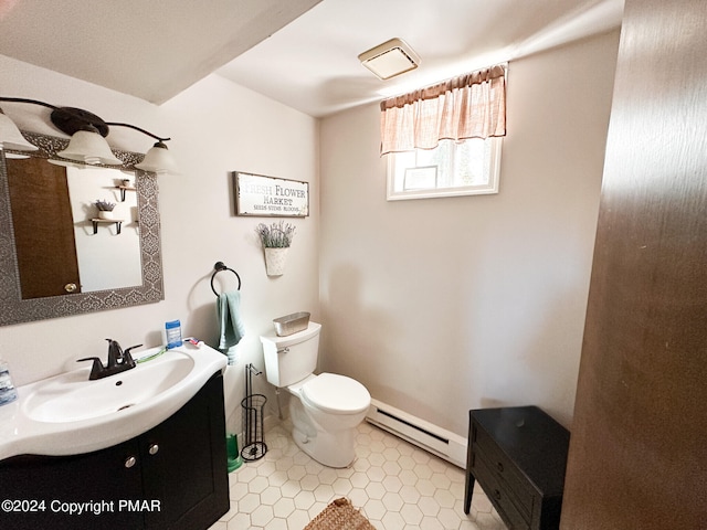 bathroom featuring baseboards, toilet, tile patterned flooring, vanity, and a baseboard heating unit