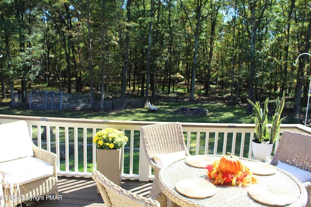 wooden deck with a yard