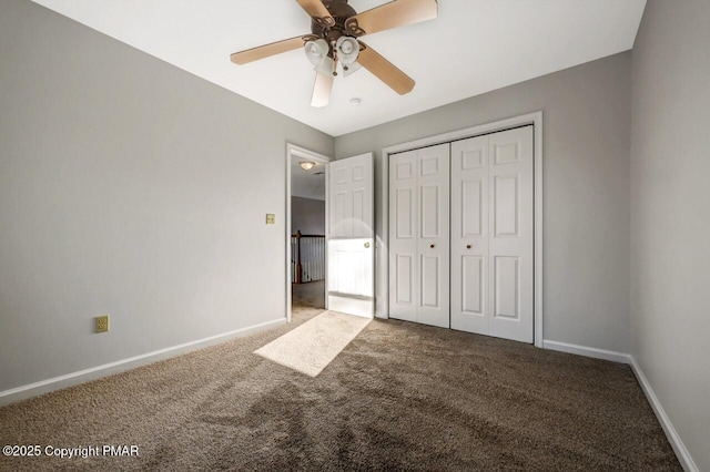 unfurnished bedroom featuring carpet, a closet, ceiling fan, and baseboards