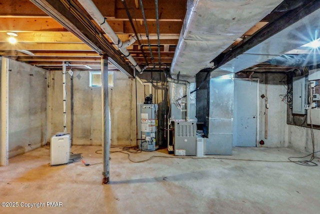 basement featuring heating unit, electric panel, and gas water heater