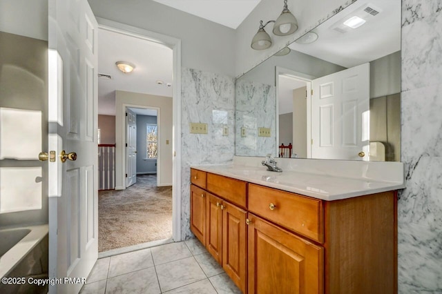 full bath featuring tile patterned flooring, visible vents, and vanity