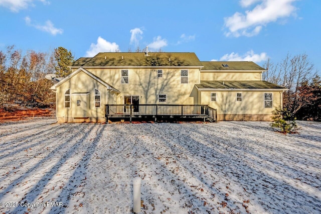 back of house with a wooden deck