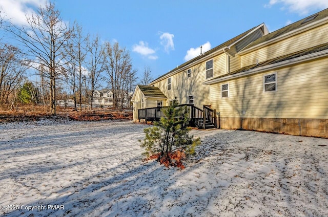 view of property exterior featuring a deck