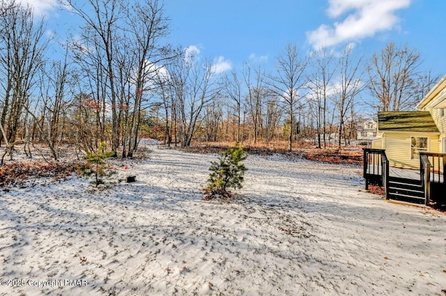 view of yard with a wooden deck