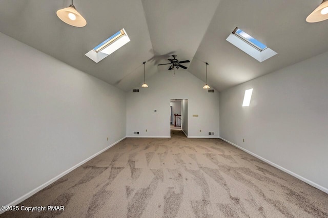 interior space featuring carpet floors, baseboards, visible vents, and lofted ceiling