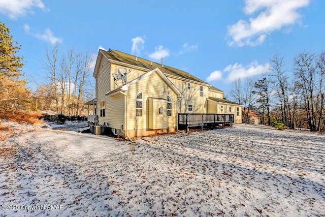 exterior space featuring cooling unit and a wooden deck