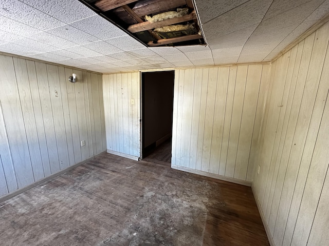 spare room with wooden walls