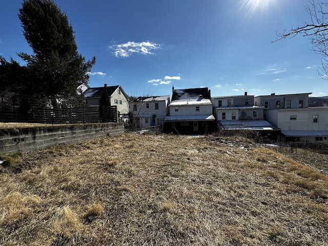 view of yard featuring a residential view and fence