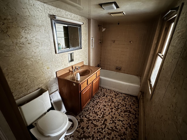 bathroom featuring vanity, tile patterned flooring, shower / bath combination, toilet, and a textured wall