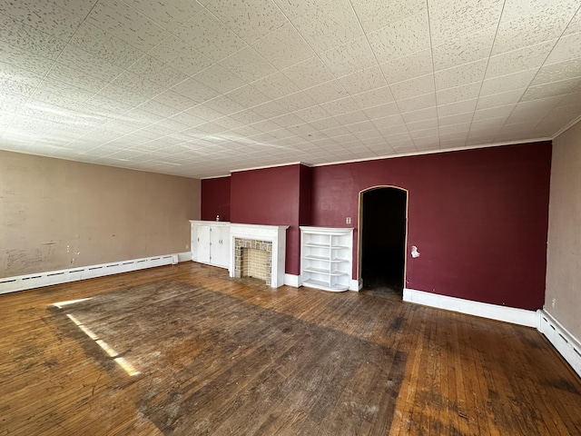 unfurnished living room featuring arched walkways, wood-type flooring, a fireplace, baseboards, and baseboard heating