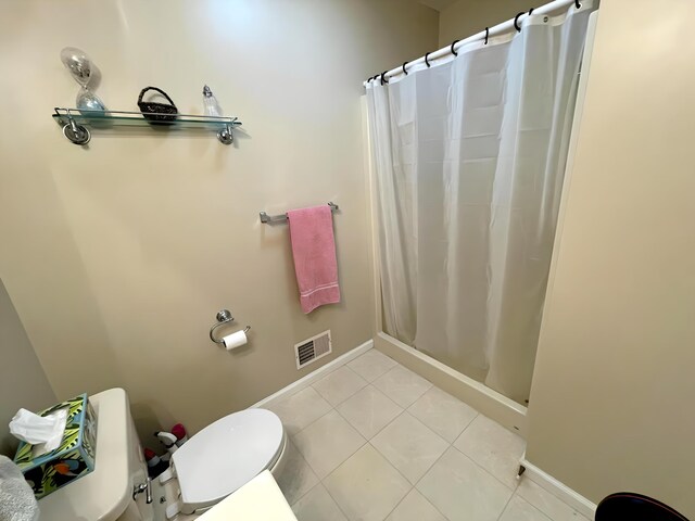 129 Birchwood Rd, Blakeslee, PA 18610 - bathroom with toilet, a shower with curtain, tile patterned flooring, and baseboards