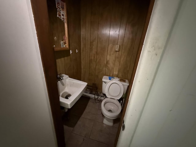5 S 9th St, Stroudsburg, PA 18360 - half bath featuring tile patterned flooring and wood walls