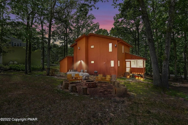 138 Banbury Dr, Bushkill, PA 18324 - view of side of home featuring a fire pit and entry steps