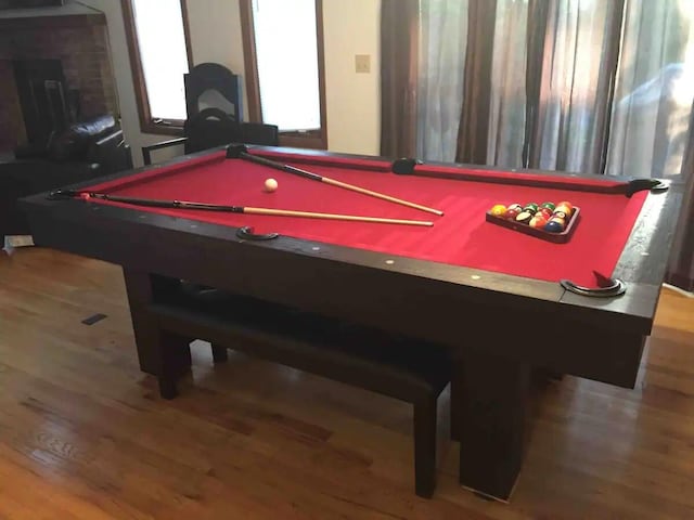138 Banbury Dr, Bushkill, PA 18324 - game room featuring pool table, wood finished floors, and a brick fireplace