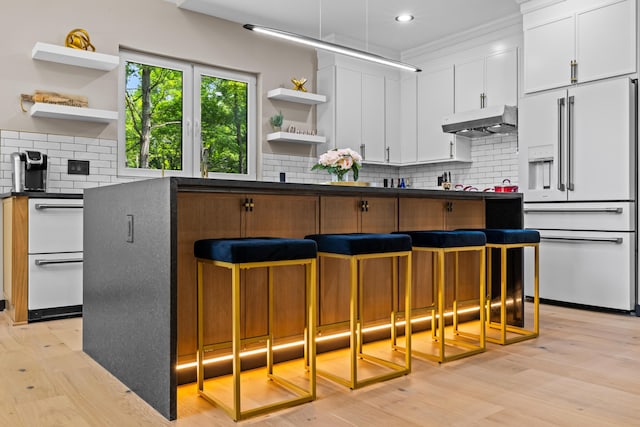2154 Valleyview Dr, Bushkill, PA 18324 - kitchen featuring open shelves, high end white refrigerator, under cabinet range hood, dark countertops, and recessed lighting