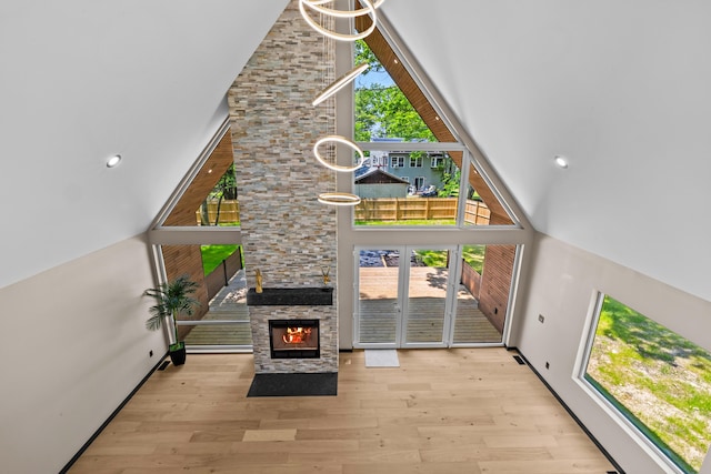 2154 Valleyview Dr, Bushkill, PA 18324 - entrance foyer with a towering ceiling, plenty of natural light, wood finished floors, and a fireplace