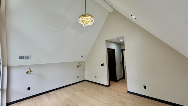 2154 Valleyview Dr, Bushkill, PA 18324 - bonus room with light wood finished floors, baseboards, and high vaulted ceiling