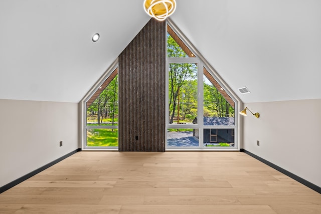 2154 Valleyview Dr, Bushkill, PA 18324 - bonus room featuring vaulted ceiling, baseboards, and wood finished floors