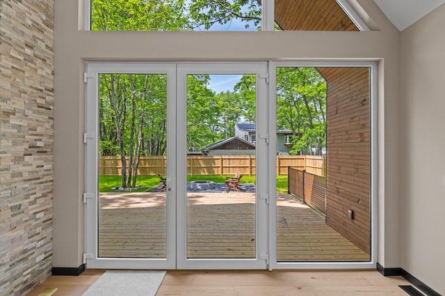 2154 Valleyview Dr, Bushkill, PA 18324 - doorway to outside featuring wood finished floors, vaulted ceiling, and baseboards