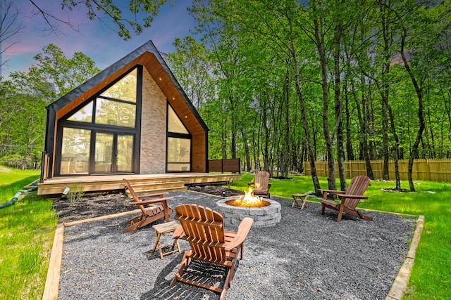 2154 Valleyview Dr, Bushkill, PA 18324 - patio terrace at dusk featuring a fire pit and a deck