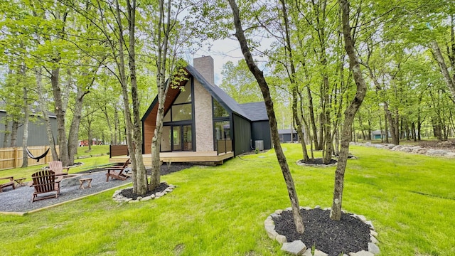 2154 Valleyview Dr, Bushkill, PA 18324 - back of house with a chimney, a yard, and a fire pit