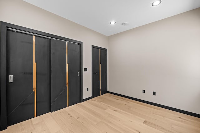2154 Valleyview Dr, Bushkill, PA 18324 - unfurnished bedroom featuring light wood-type flooring, recessed lighting, two closets, and baseboards
