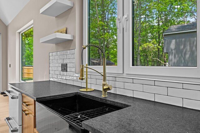 2154 Valleyview Dr, Bushkill, PA 18324 - kitchen featuring ventilation hood, white fridge with ice dispenser, stainless steel range, light wood-type flooring, and dark countertops