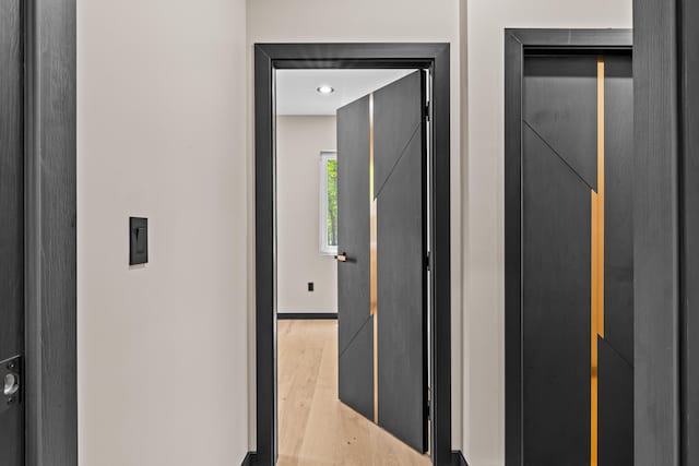 2154 Valleyview Dr, Bushkill, PA 18324 - hallway featuring wood finished floors, baseboards, and elevator