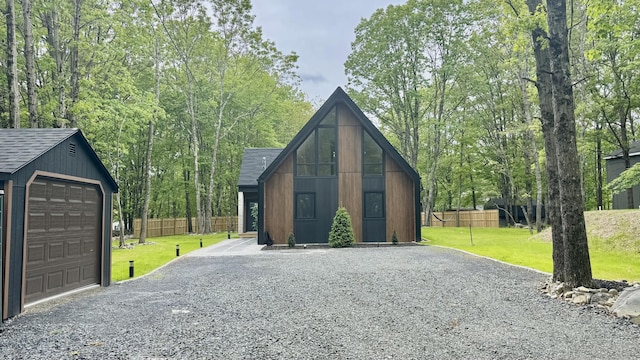 2154 Valleyview Dr, Bushkill, PA 18324 - view of front of house with driveway, an outdoor structure, a shingled roof, and a garage