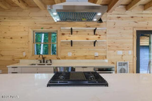 118 Eagle Rock Rd, Lackawaxen, PA 18435 - kitchen featuring wooden walls, exhaust hood, light countertops, stovetop, and beamed ceiling