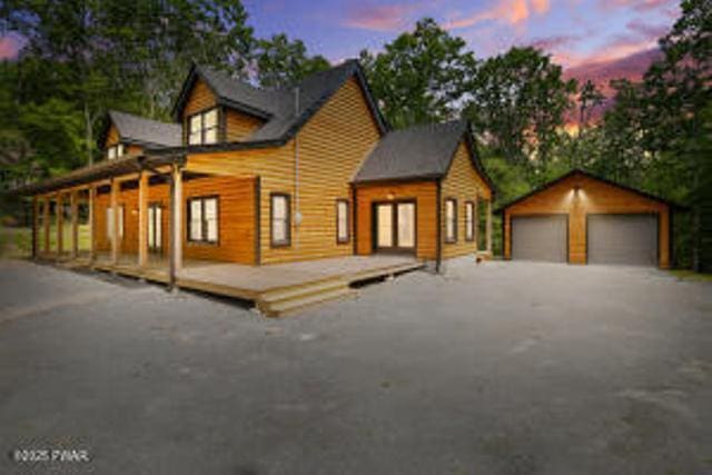 118 Eagle Rock Rd, Lackawaxen, PA 18435 - chalet / cabin with a garage, an outdoor structure, and a wooden deck