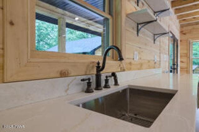 118 Eagle Rock Rd, Lackawaxen, PA 18435 - kitchen view of a sink and wooden walls