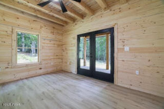 118 Eagle Rock Rd, Lackawaxen, PA 18435 - empty room featuring wood finished floors, wood walls, french doors, a ceiling fan, and a wooden ceiling with exposed beams