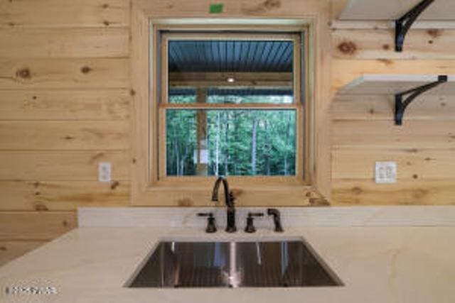 118 Eagle Rock Rd, Lackawaxen, PA 18435 - kitchen with wooden walls and light countertops