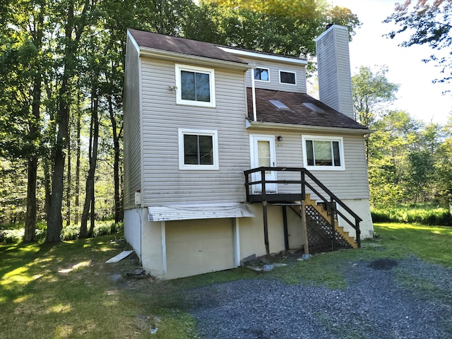 911 Granite Ter, Tobyhanna, PA 18466 - rear view of property featuring a chimney, a garage, and a shingled roof