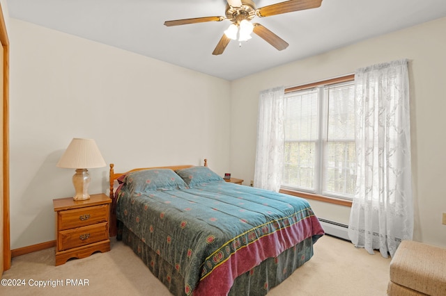 bedroom featuring ceiling fan, baseboards, baseboard heating, and light colored carpet