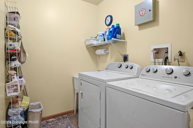 laundry room with washer and dryer, laundry area, and baseboards