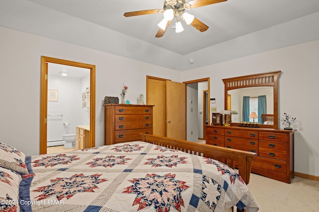 bedroom featuring light carpet, baseboards, ceiling fan, ensuite bathroom, and baseboard heating