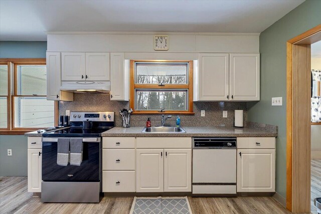 kitchen featuring stainless steel range with electric cooktop, white dishwasher, a sink, white cabinetry, and under cabinet range hood