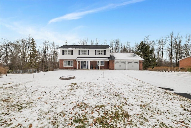 view of front of property featuring a garage and brick siding