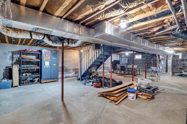 unfinished basement featuring stairway