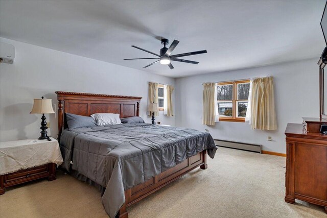 bedroom with carpet floors, baseboards, a baseboard heating unit, and a ceiling fan