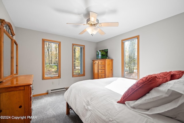 carpeted bedroom featuring a ceiling fan, a baseboard radiator, and baseboards