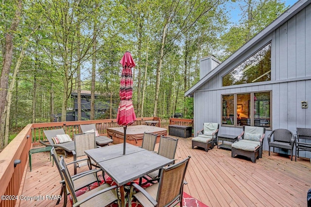 wooden deck with outdoor dining space and outdoor lounge area